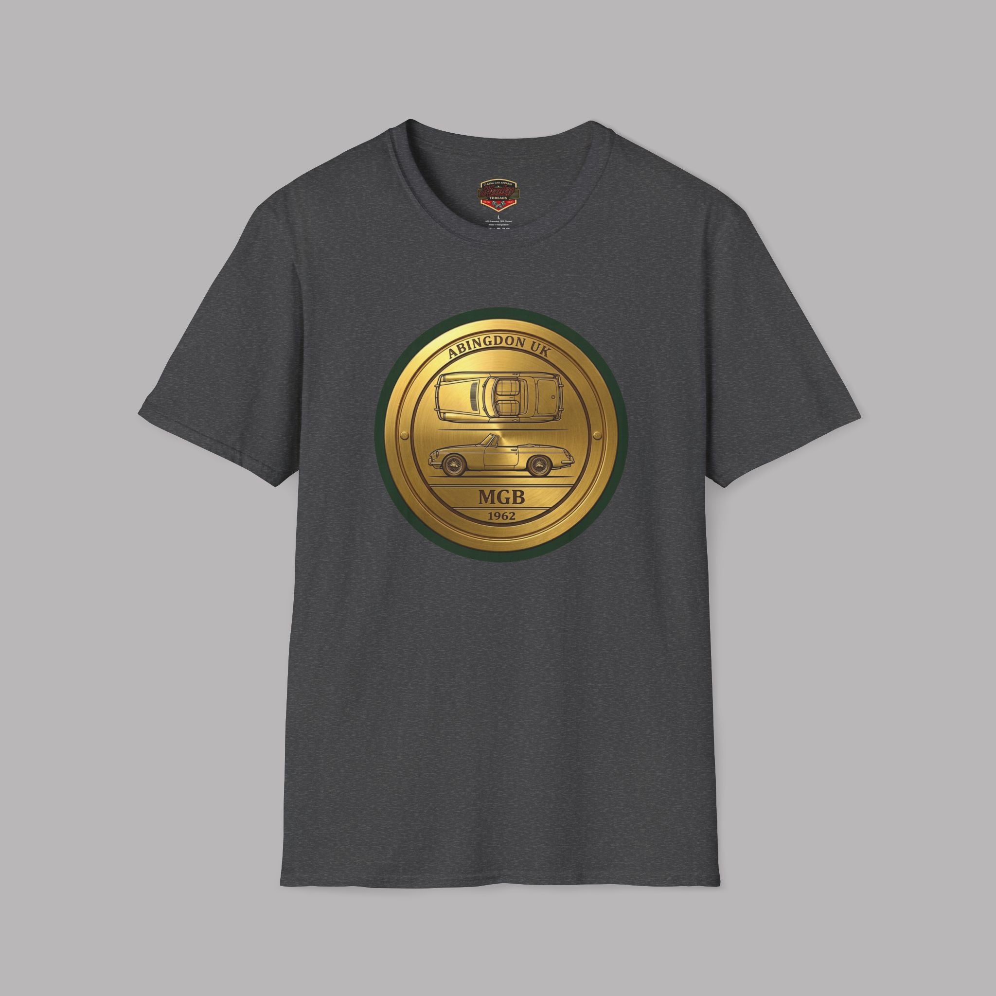 Dark heather t-shirt with a gold and green classic car logo on a gray background