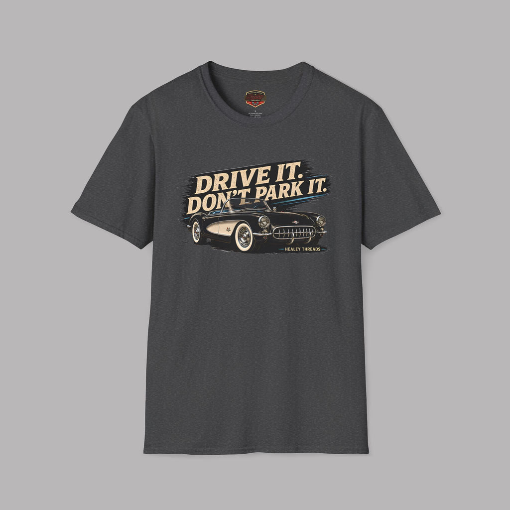 Dark heather t-shirt with a vintage car graphic and text 'Drive it. Don't park it.' on a gray background