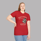 Woman wearing a red t-shirt with a graphic supercharged engine and text on a gray background