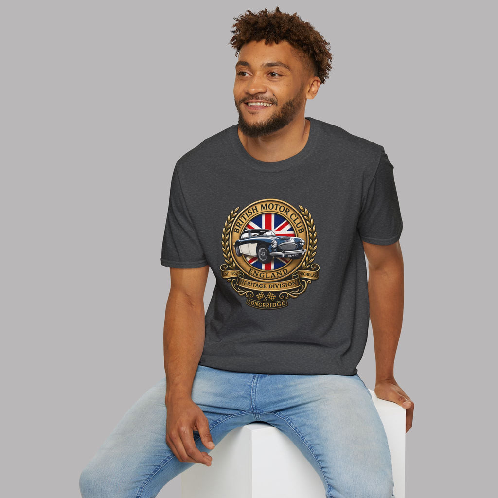 Man wearing a dark heather t-shirt with a British Motor Club logo on a gray background