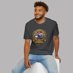 Man wearing a dark heather t-shirt with a British Motor Club logo on a gray background