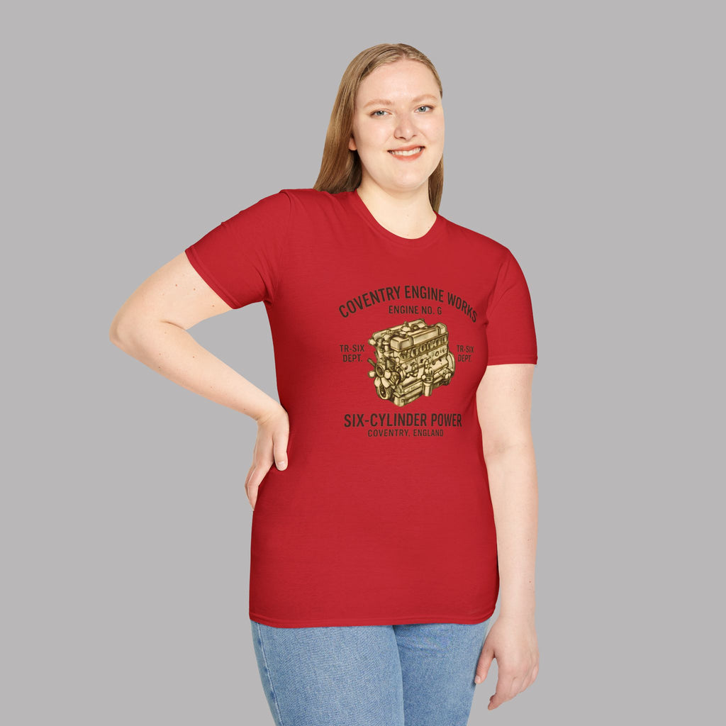 Woman wearing a red t-shirt with 'Coventry Engine Works'  graphic and text on a gray background