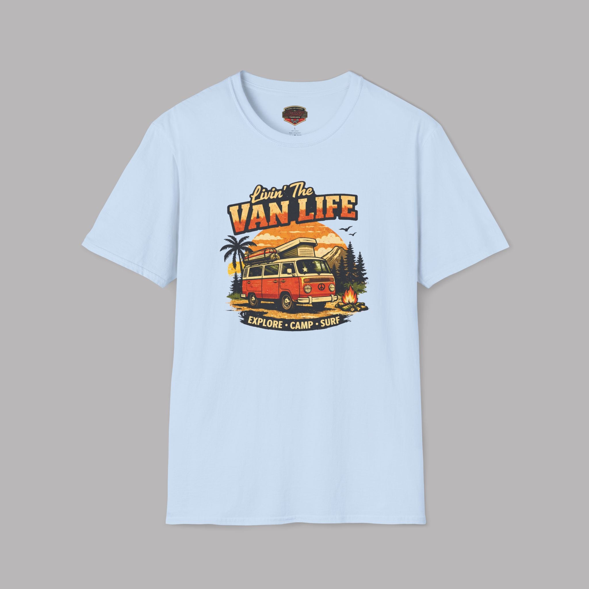 Light blue t-shirt with 'Van Life' graphic design featuring a van and nature elements on a gray background.