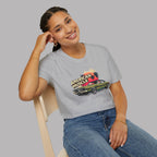 Woman wearing a gray t-shirt with a graphic design of a muscle car and 'American Muscle' text.