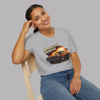 Woman wearing a sport gray t-shirt with 'American Muscle' graphic design.