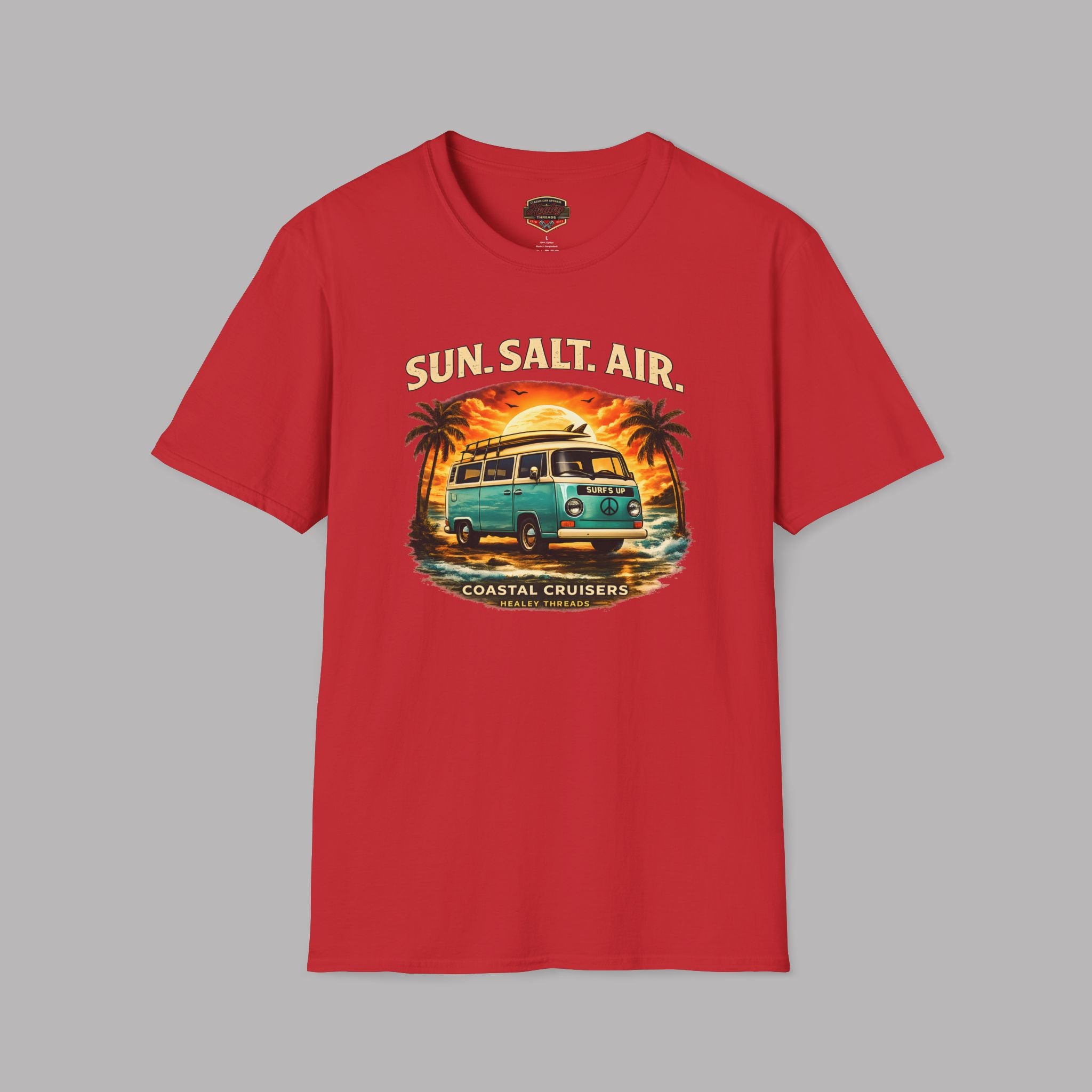 Red t-shirt with a graphic classic design of a van, palm trees, and 'Sun, Salt, Air' text on a gray background.