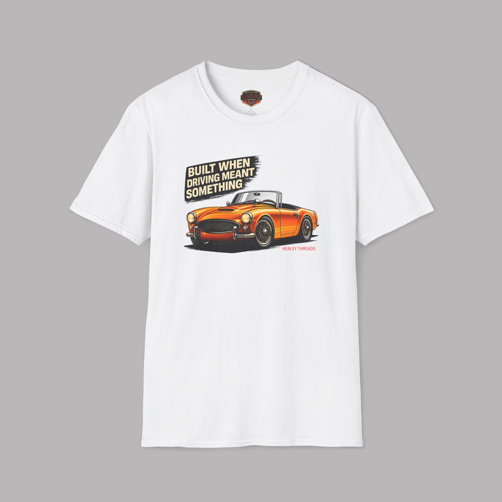 White t-shirt with an orange car graphic and text on a gray background