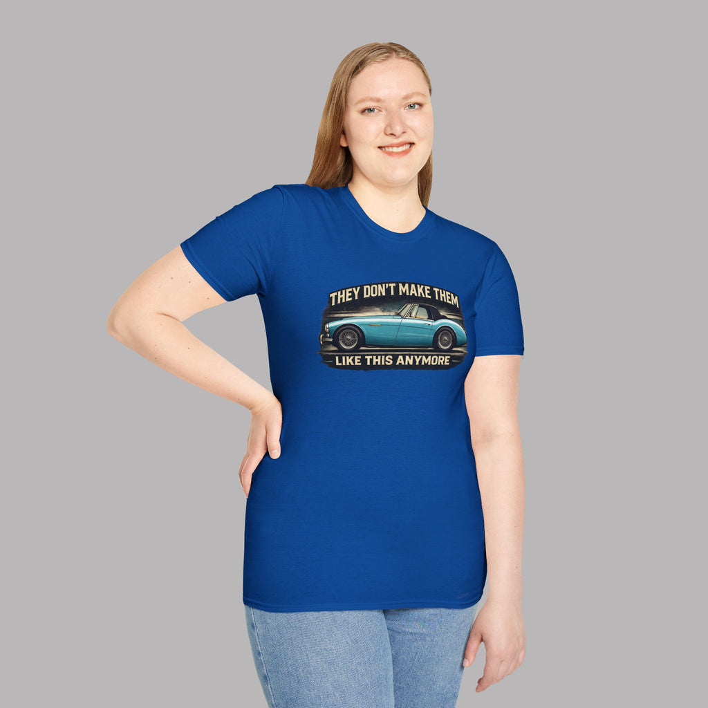 Woman wearing a royal blue t-shirt with a graphic and text on a gray background
