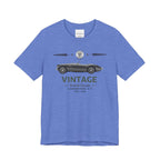 Blue t-shirt with vintage car graphic and text on a white background