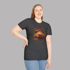 Woman wearing a dark heather t-shirt with 'American Muscle' graphic design on a gray background