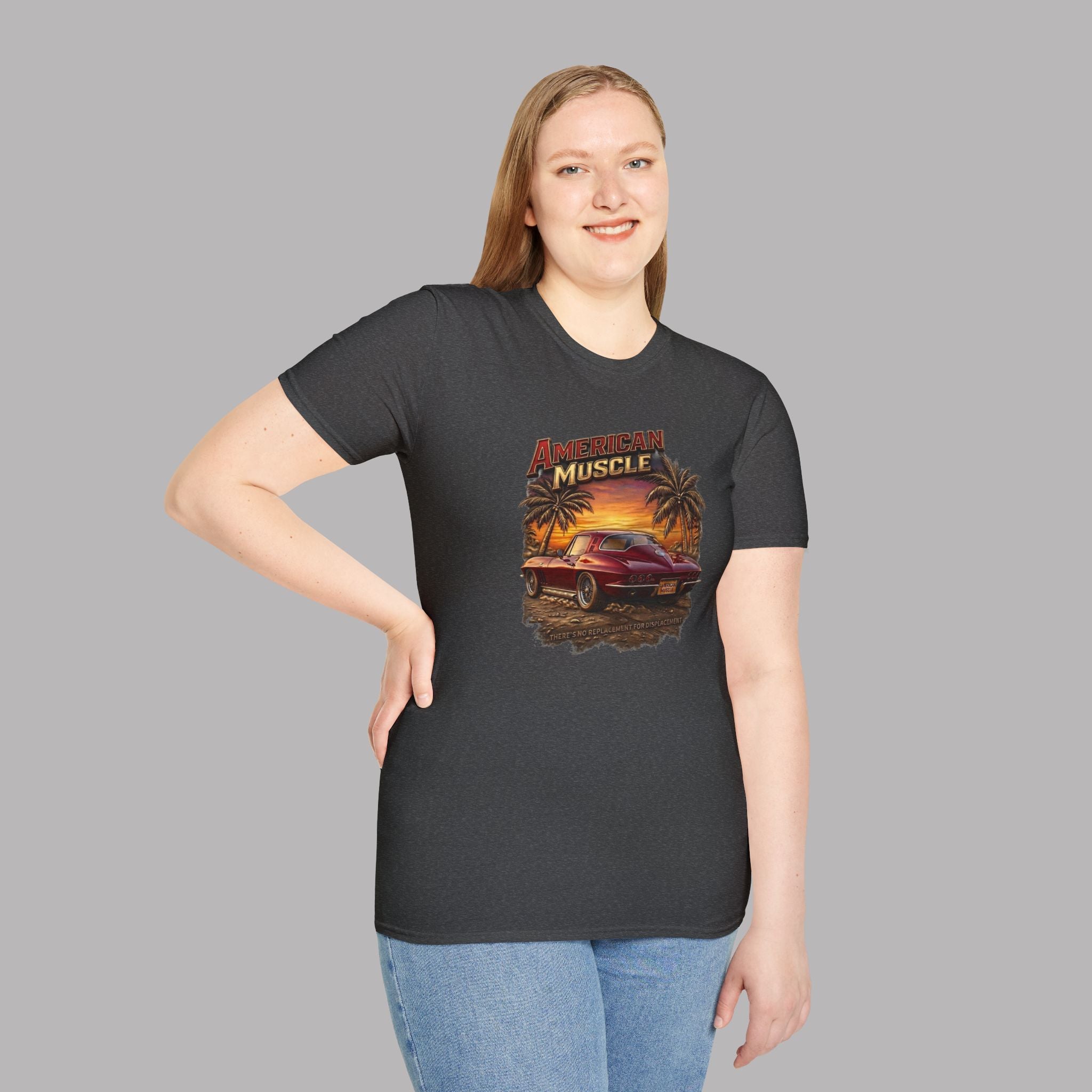 Woman wearing a dark heather t-shirt with 'American Muscle' graphic design on a gray background