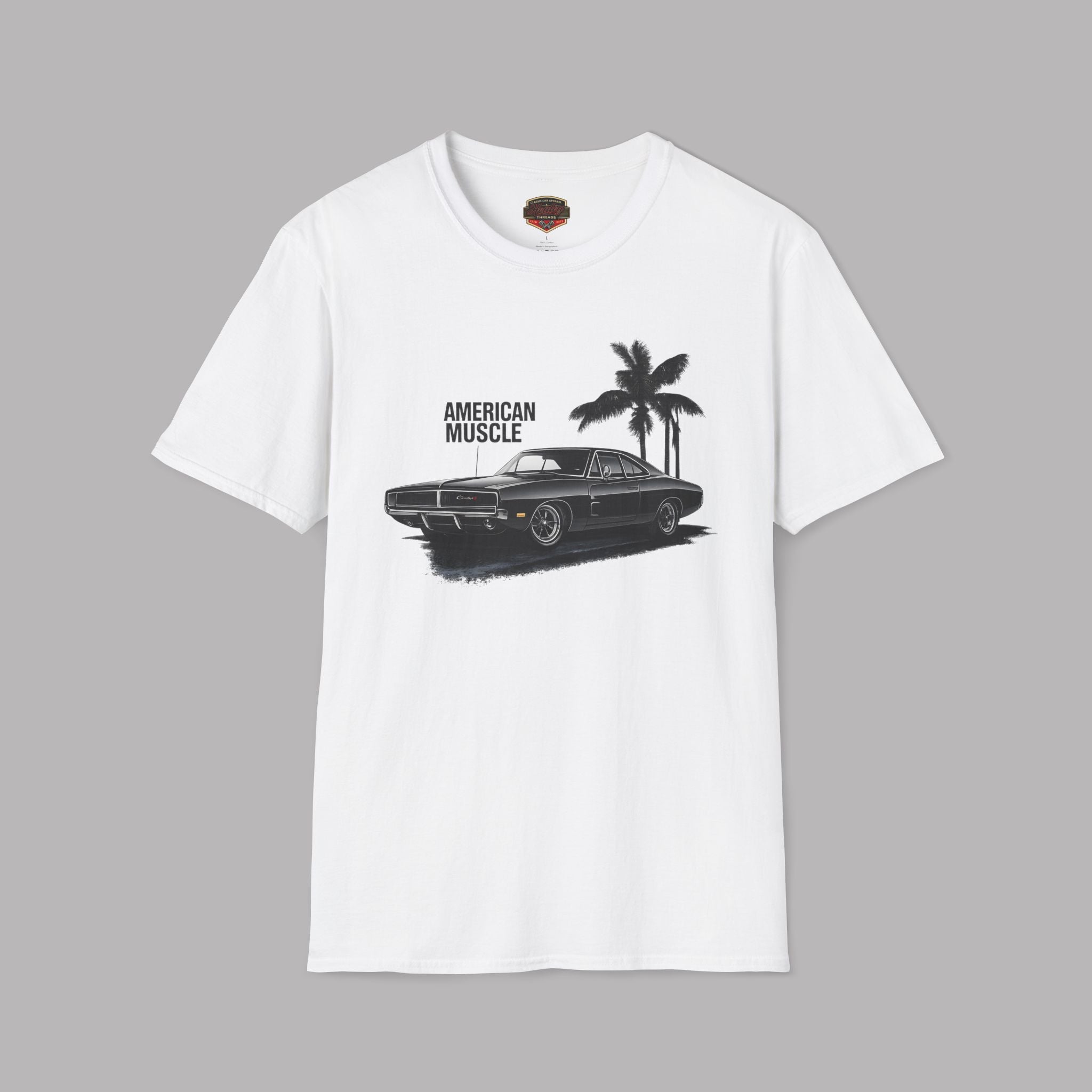 White t-shirt with black graphic of a car and palm tree on a gray background
