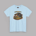 A light blue short-sleeve crewneck t-shirt featuring a vintage graphic of a black sports car with flames and the text 'Life is too short. Always a Classic Legend 1962'.