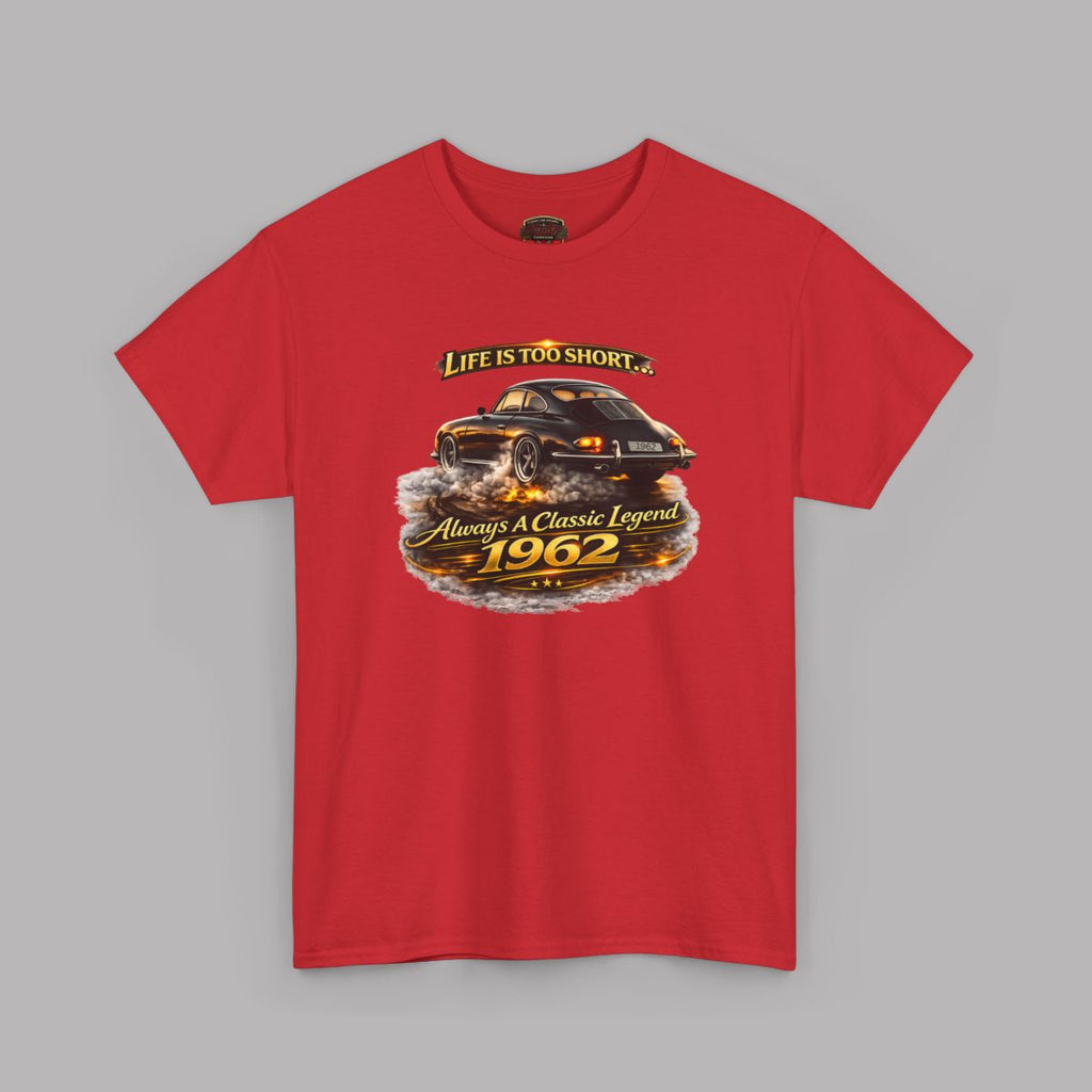 A red short-sleeve crewneck t-shirt featuring a graphic print of a black classic car drifting on asphalt, with the text 'LIFE IS TOO SHORT.' above and 'Always A Classic Legend 1962' below.