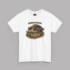 A white short-sleeve crewneck t-shirt with a graphic print of a classic car and the text 'Life is too short. Always a Classic Legend 1962' on a solid gray background.