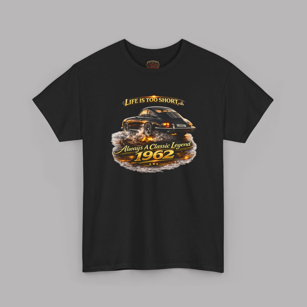 A black short-sleeve crewneck t-shirt featuring a graphic print of a classic car with flames and the text 'Life is too short to be ordinary. Always be a classic legend 1962'.