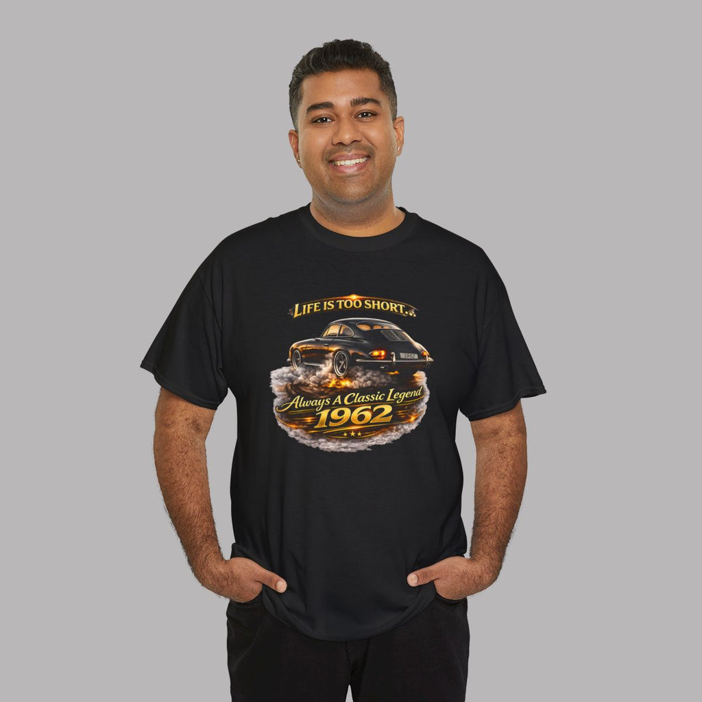 Man wearing a black short-sleeve t-shirt featuring a graphic print of a classic car with flames and the text 'Life is too short to be ordinary. Always be a classic legend 1962'.
