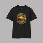 Black t-shirt with a graphic design of a car and sunset on a gray background