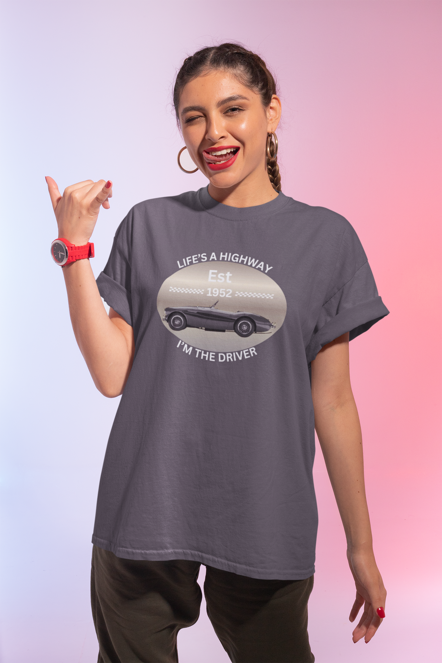 Woman wearing a gray t-shirt with a graphic design on a gradient background