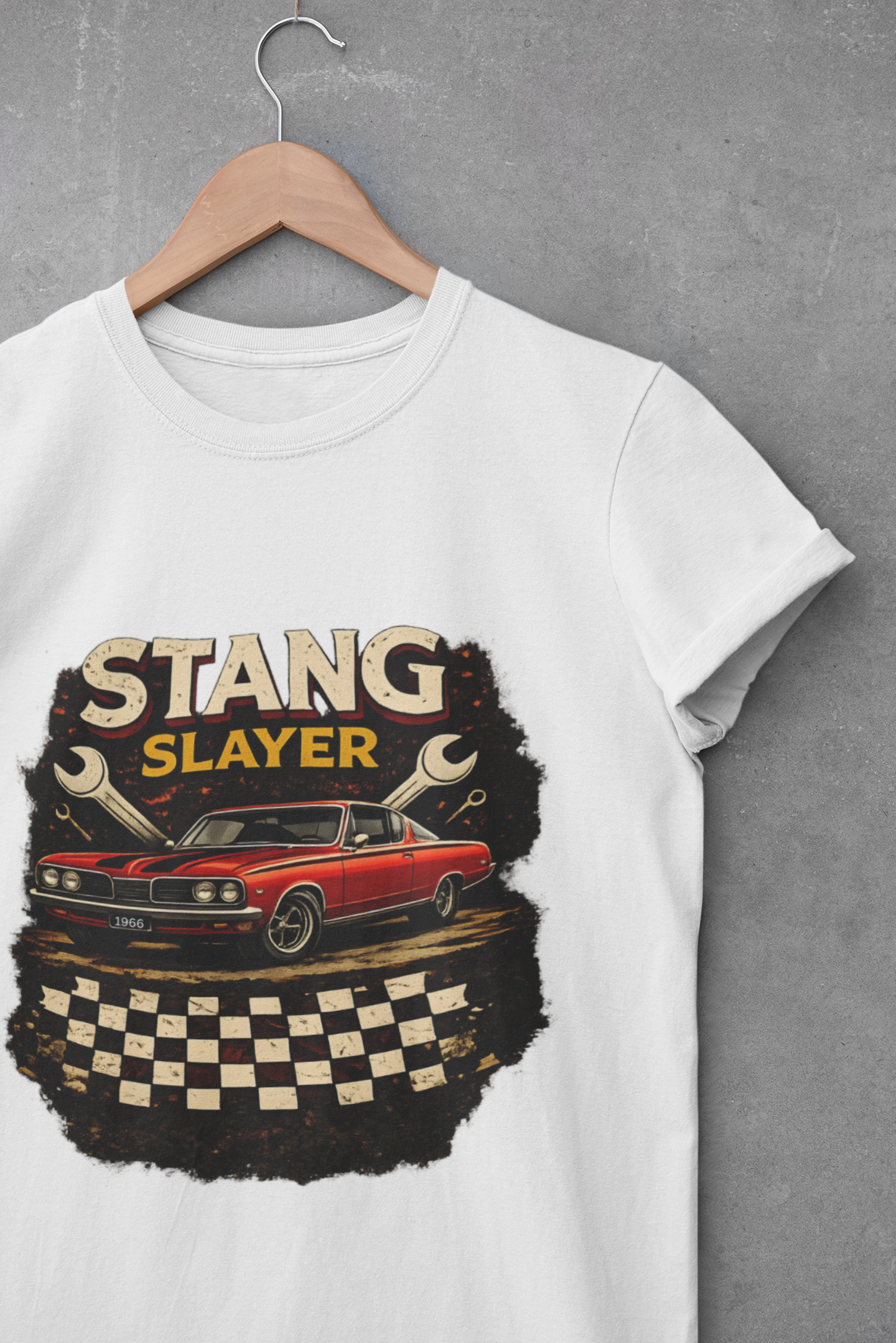 White t-shirt with 'Stang Slayer' graphic design featuring a red car on a hanger against a gray background.