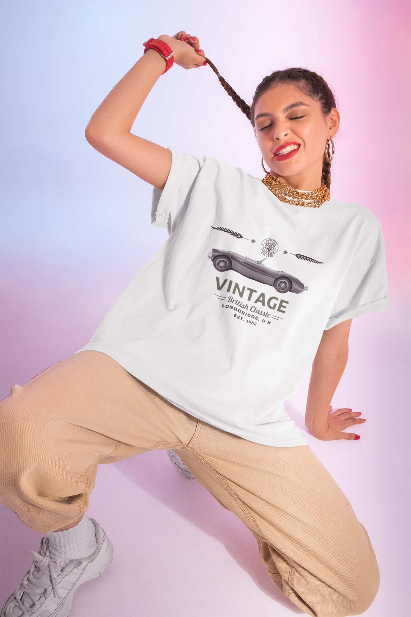 Woman wearing a white t-shirt with vintage car graphic and text, posing against a gradient background.