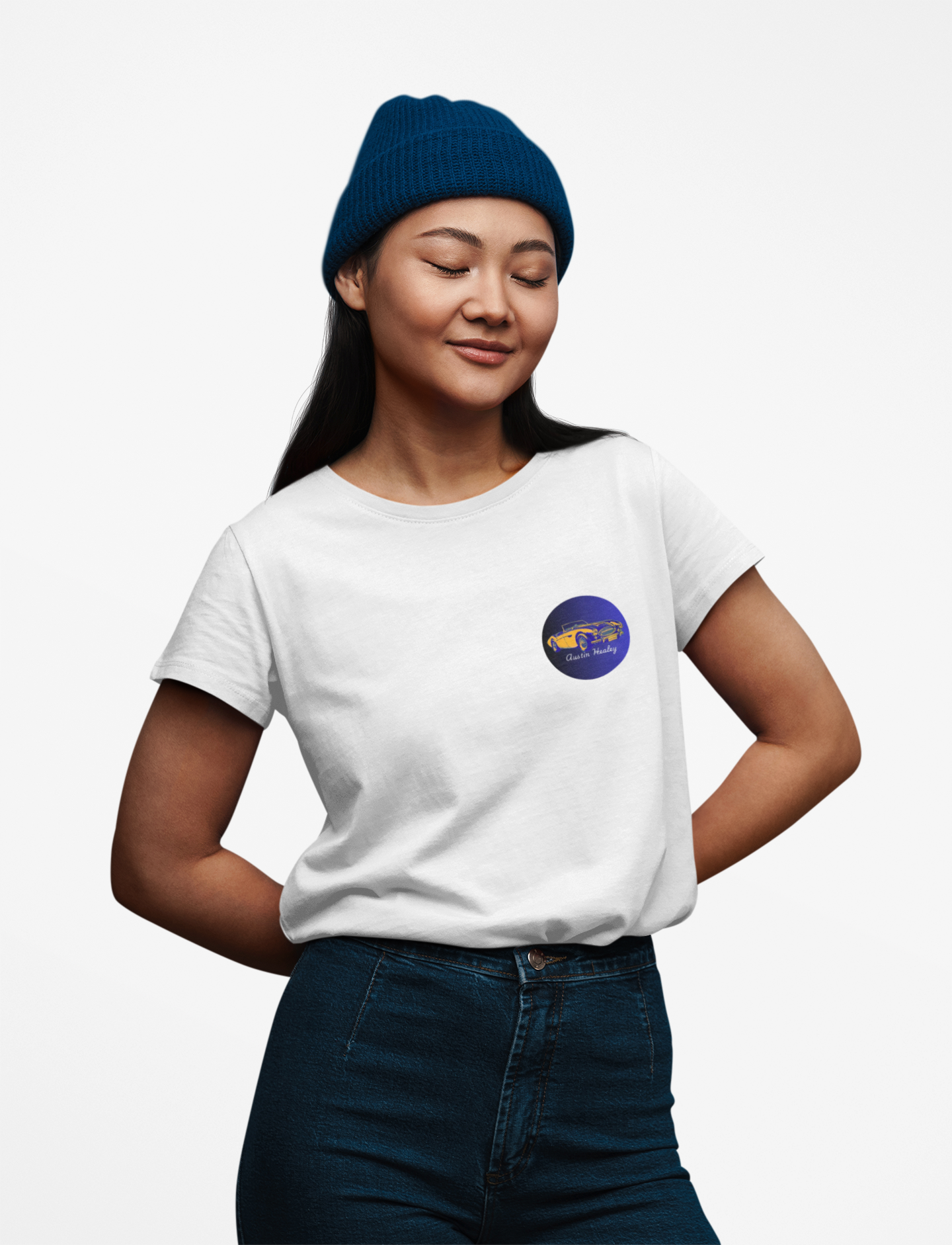 Girl wearing a white t-shirt with a logo, blue beanie, and jeans on a white background