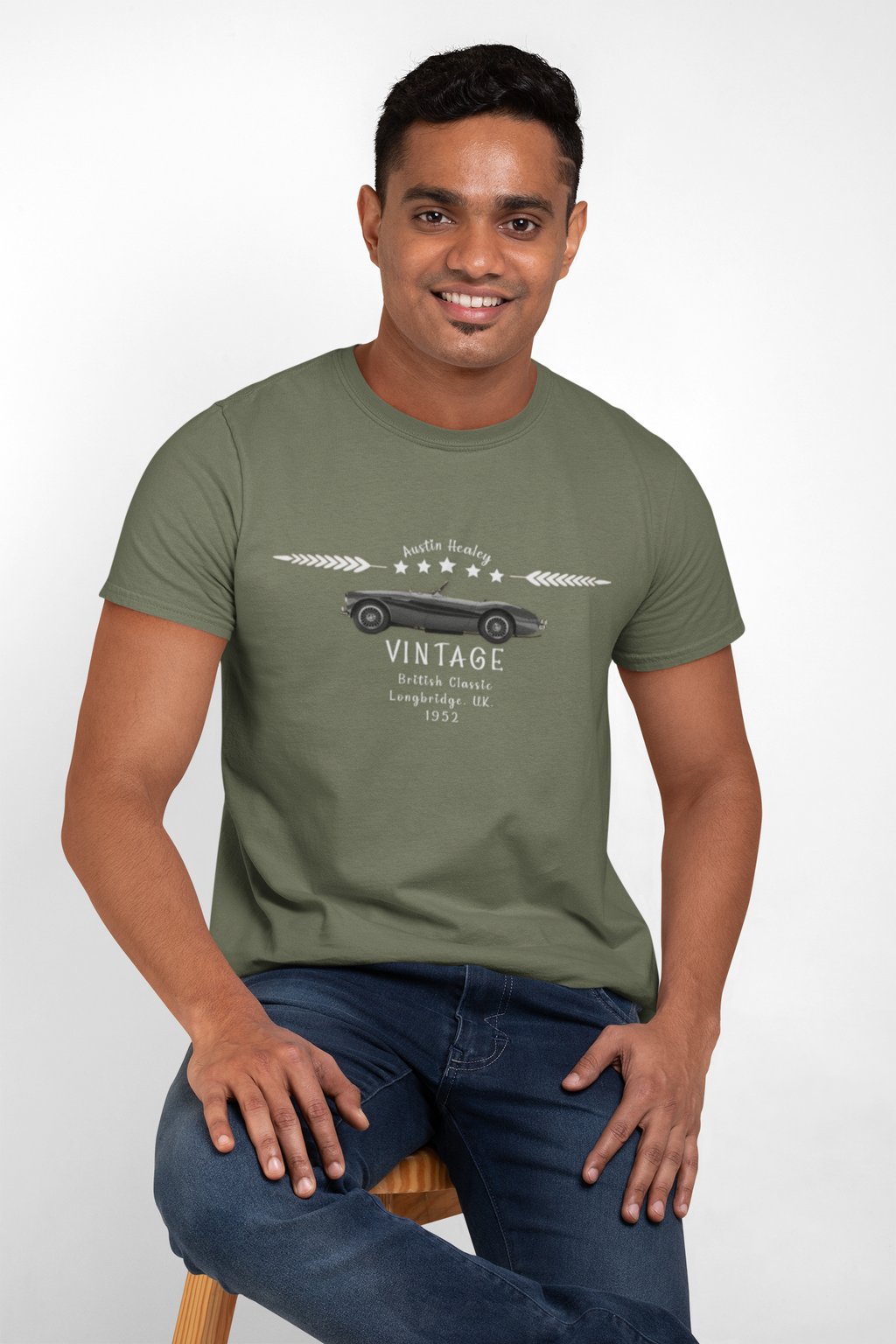 Man wearing a military green t-shirt with a graphic design on a white background