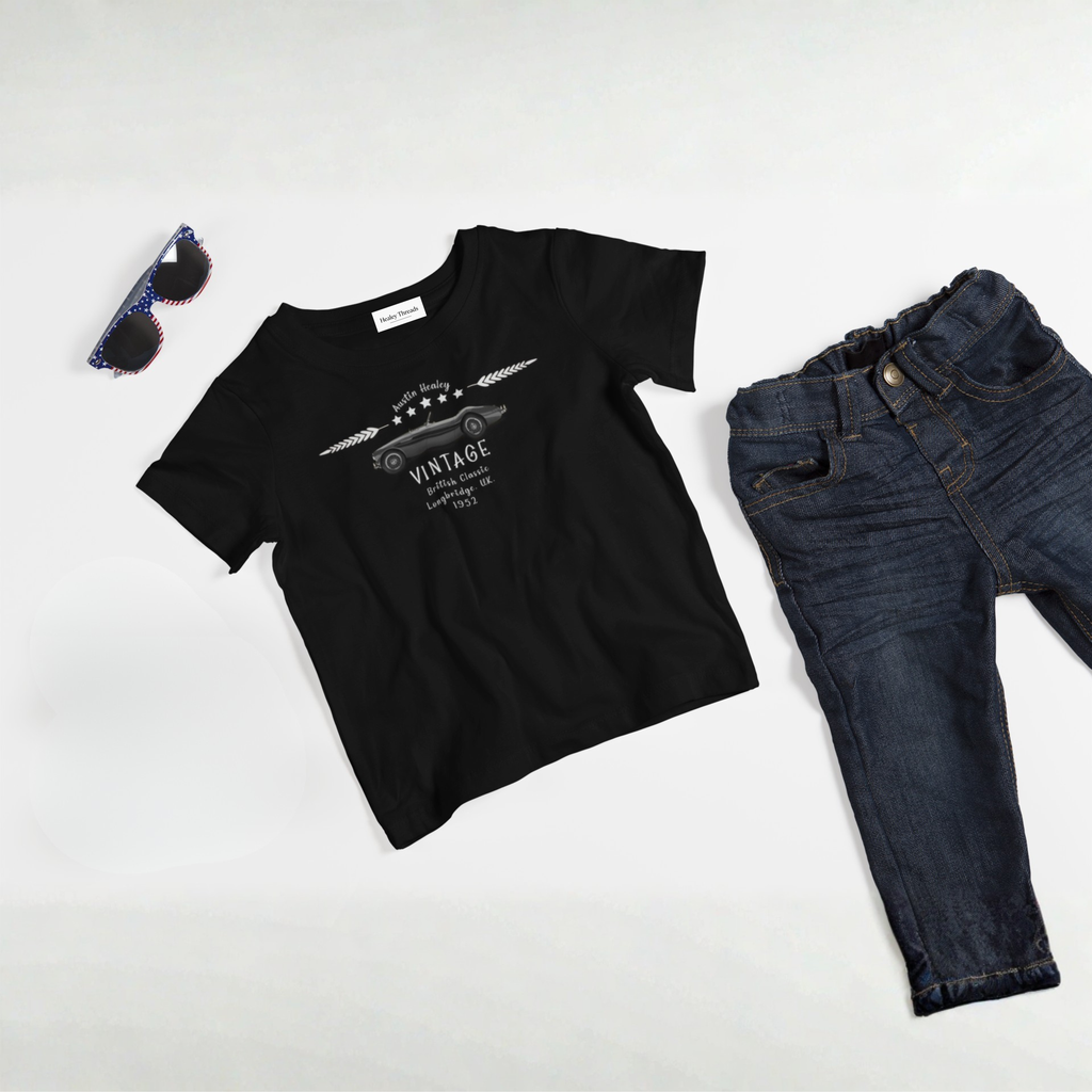 Black t-shirt with graphic design, dark jeans, and sunglasses on a white background