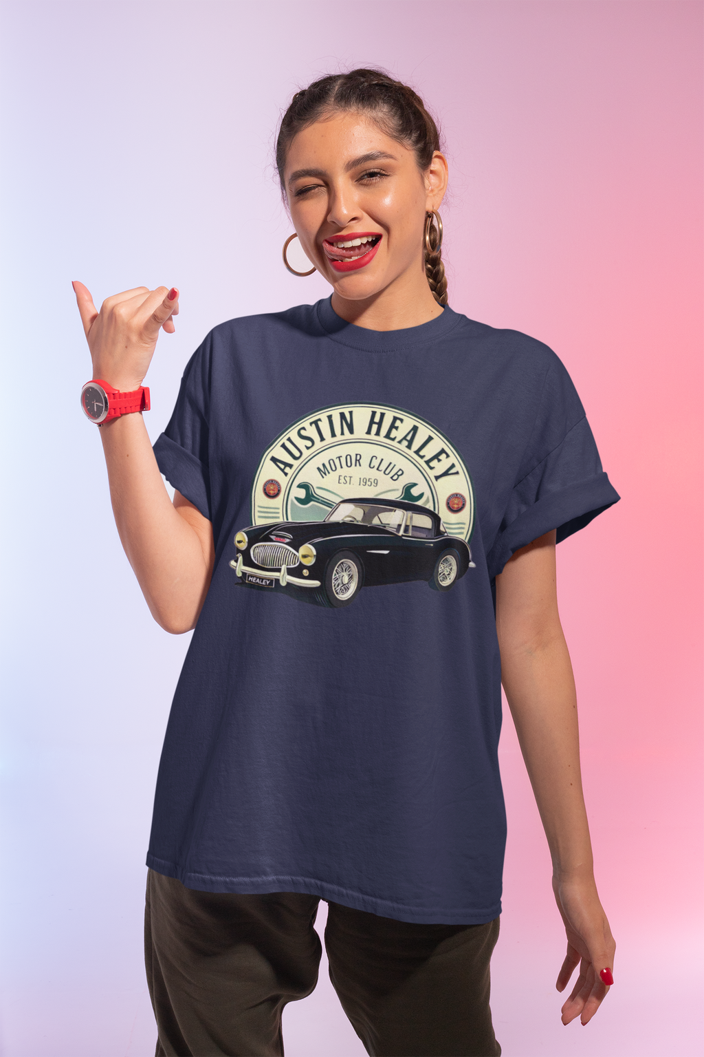 Woman wearing a navy blue t-shirt with a vintage car graphic and 'Austin Healey' text on a gradient background.