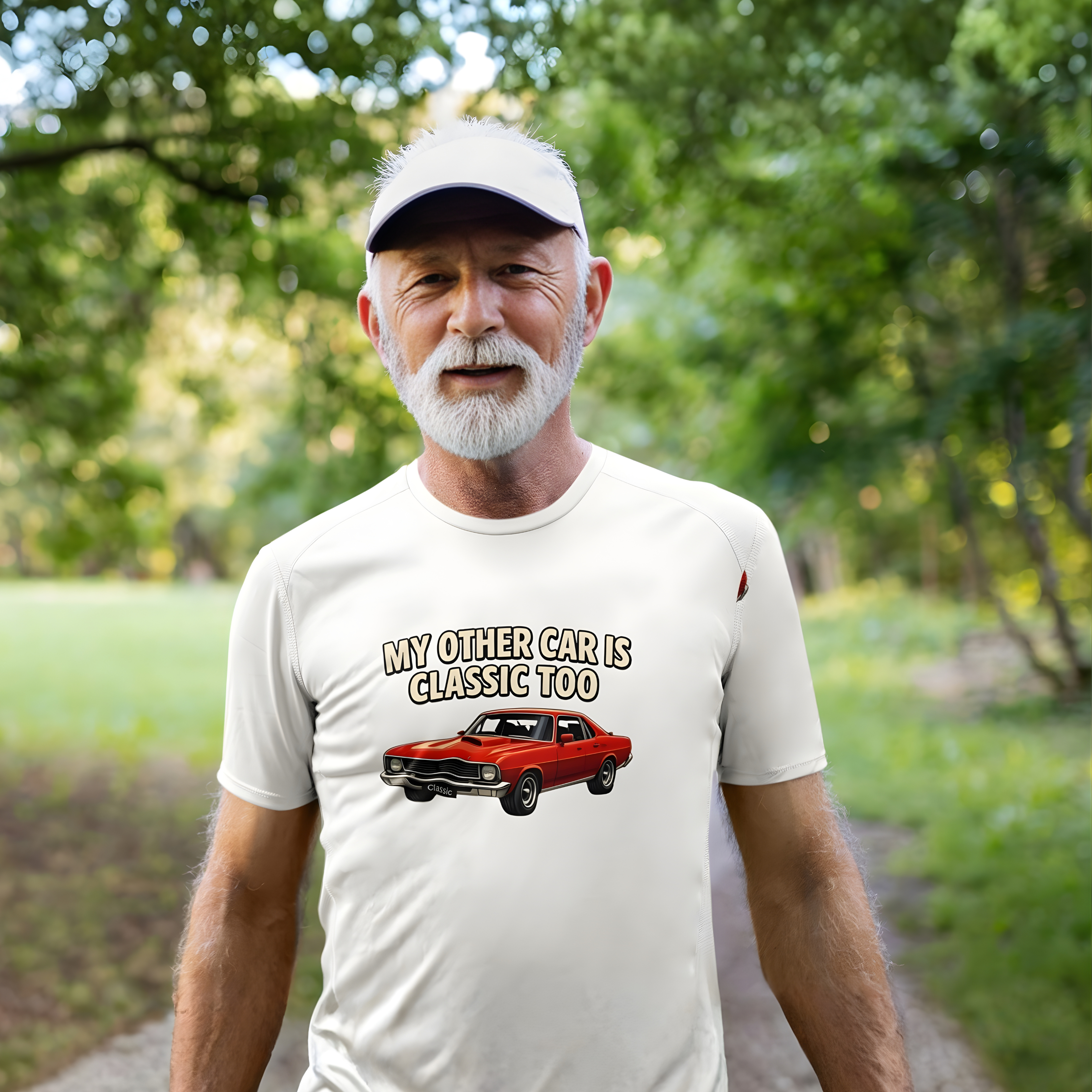 Man wearing a white t-shirt with a graphic and text, standing outdoors with greenery in the background