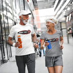 Couple wearing a white and grey t-shirt with 'Save the stick shift' graphic design jogging.