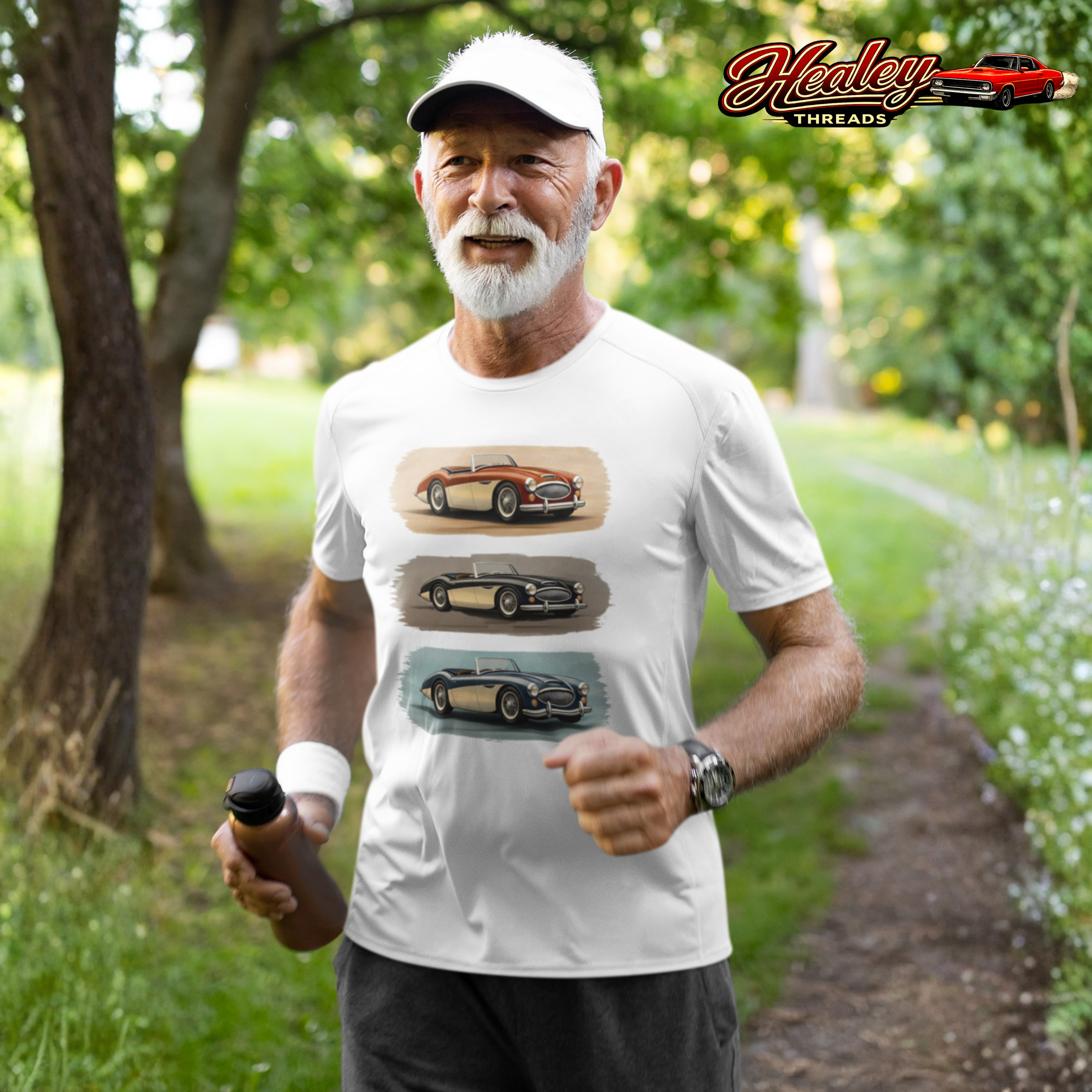 Man wearing a white Healey t-shirt with car graphics outdoors, with 'Healey Threads' logo.