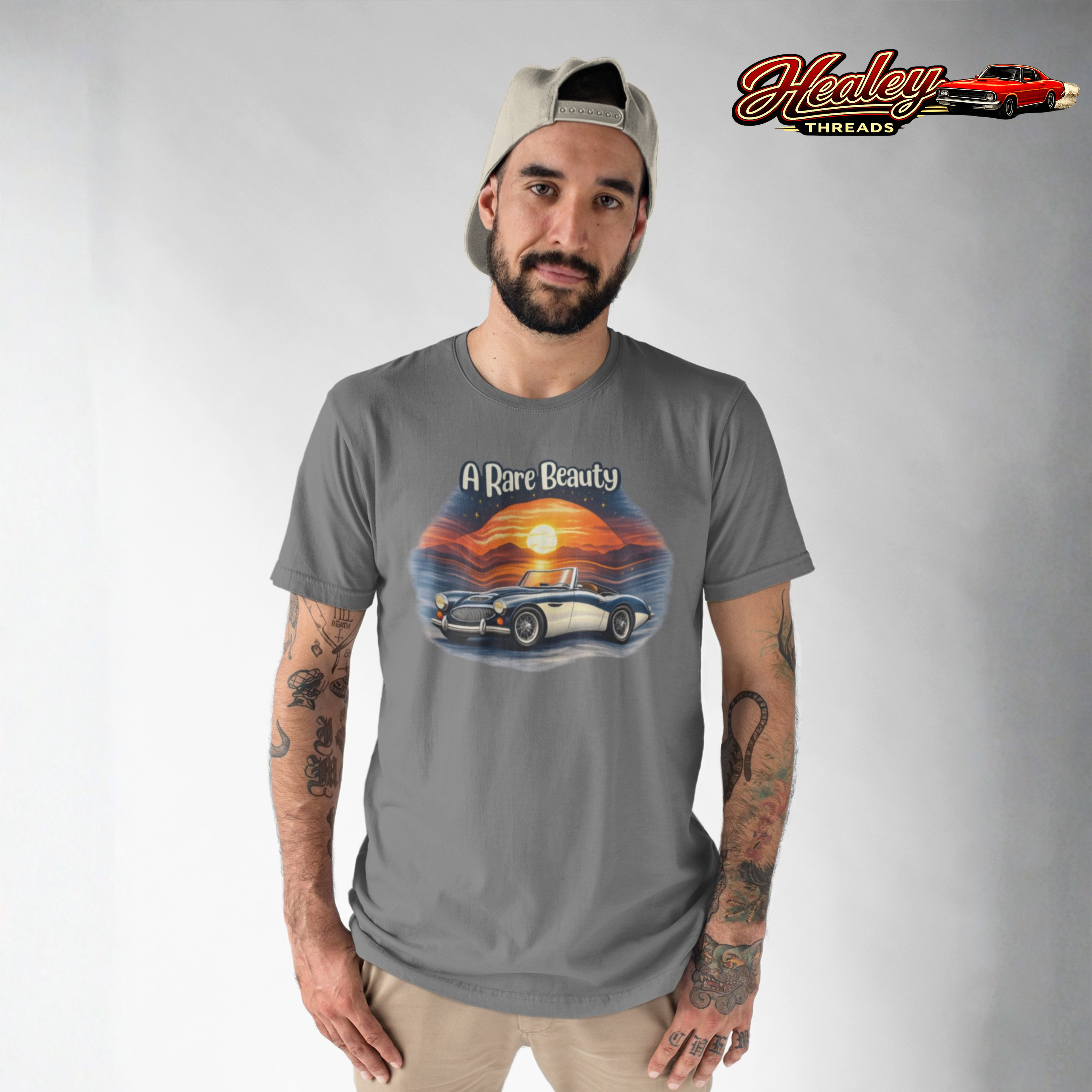 Man wearing a gray t-shirt with a car graphic and 'Healey Threads' branding.