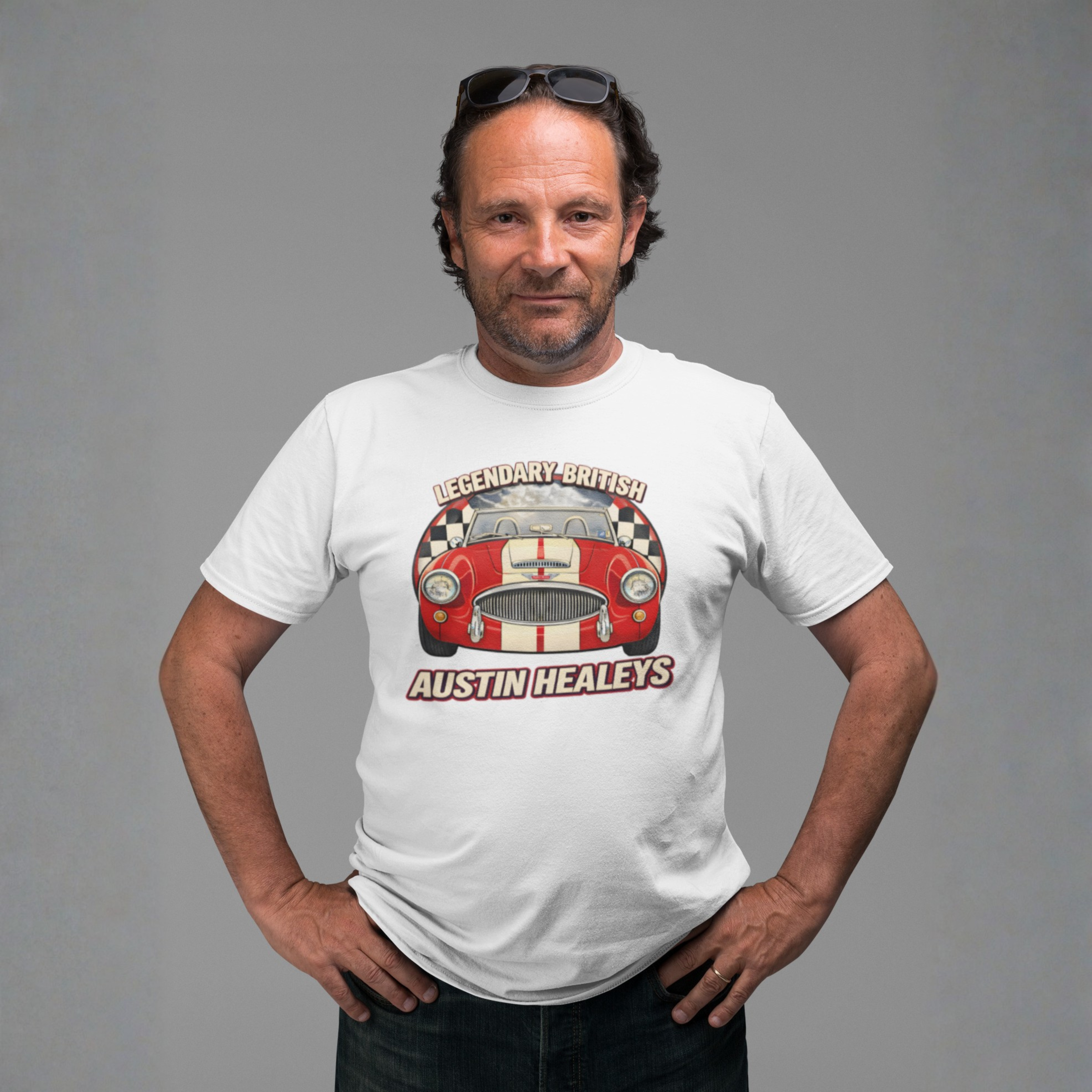 Man wearing a white t-shirt with a red Healey car graphic and text on a gray background