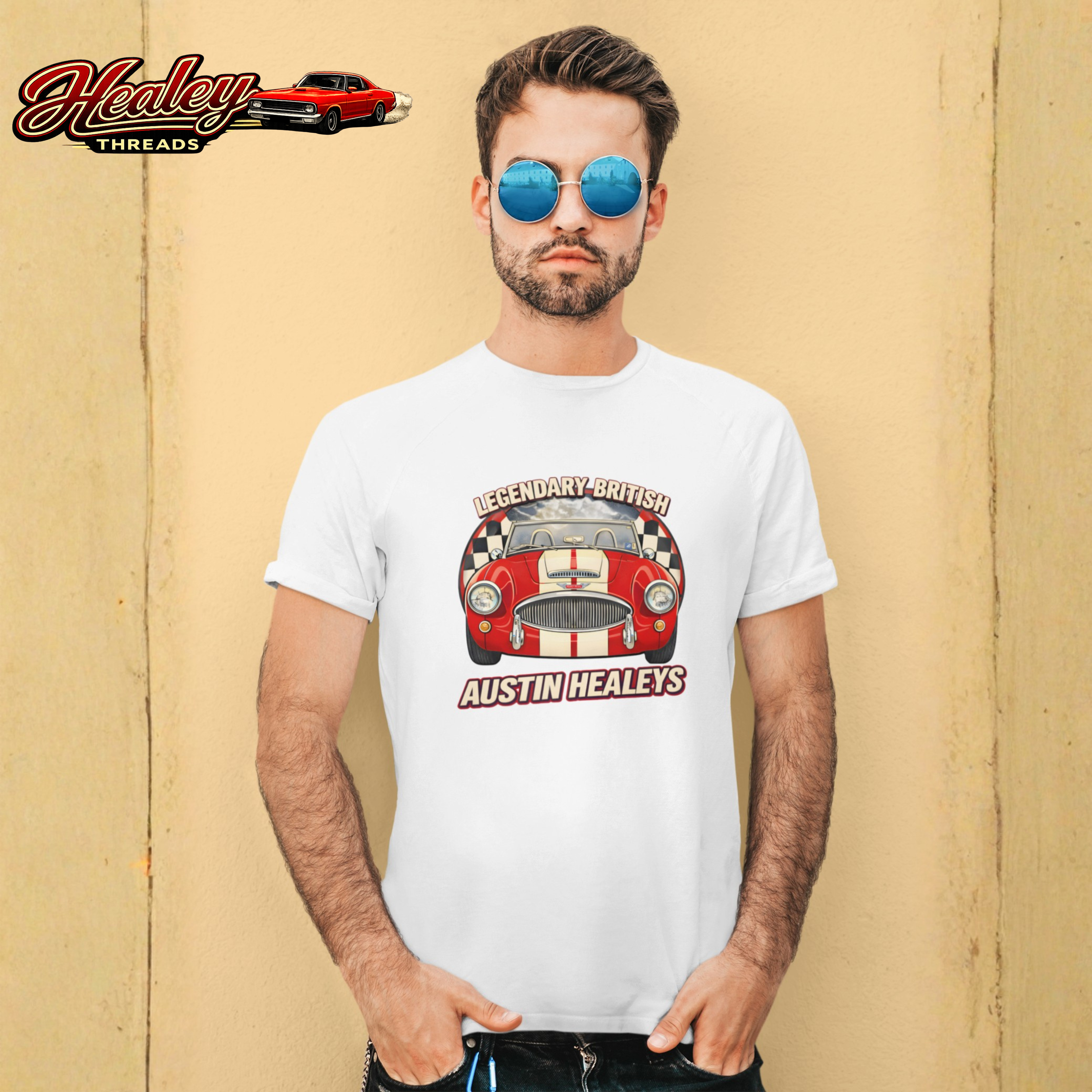 Man wearing a white t-shirt with a red car graphic and 'Austin Healey' text against a beige background.