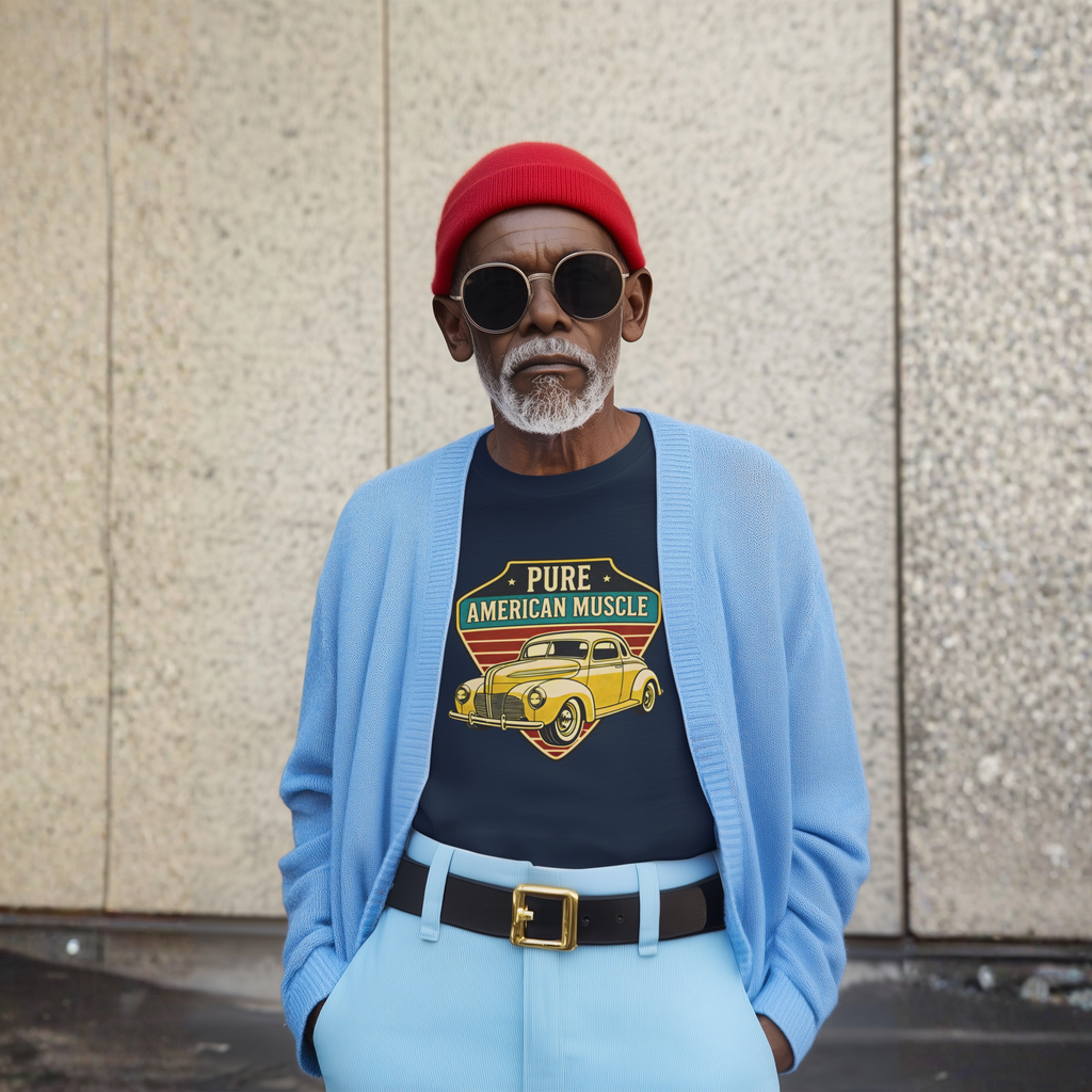 Man wearing a blue cardigan, red cap, and navy blue t-shirt with 'Pure American Muscle' graphic.