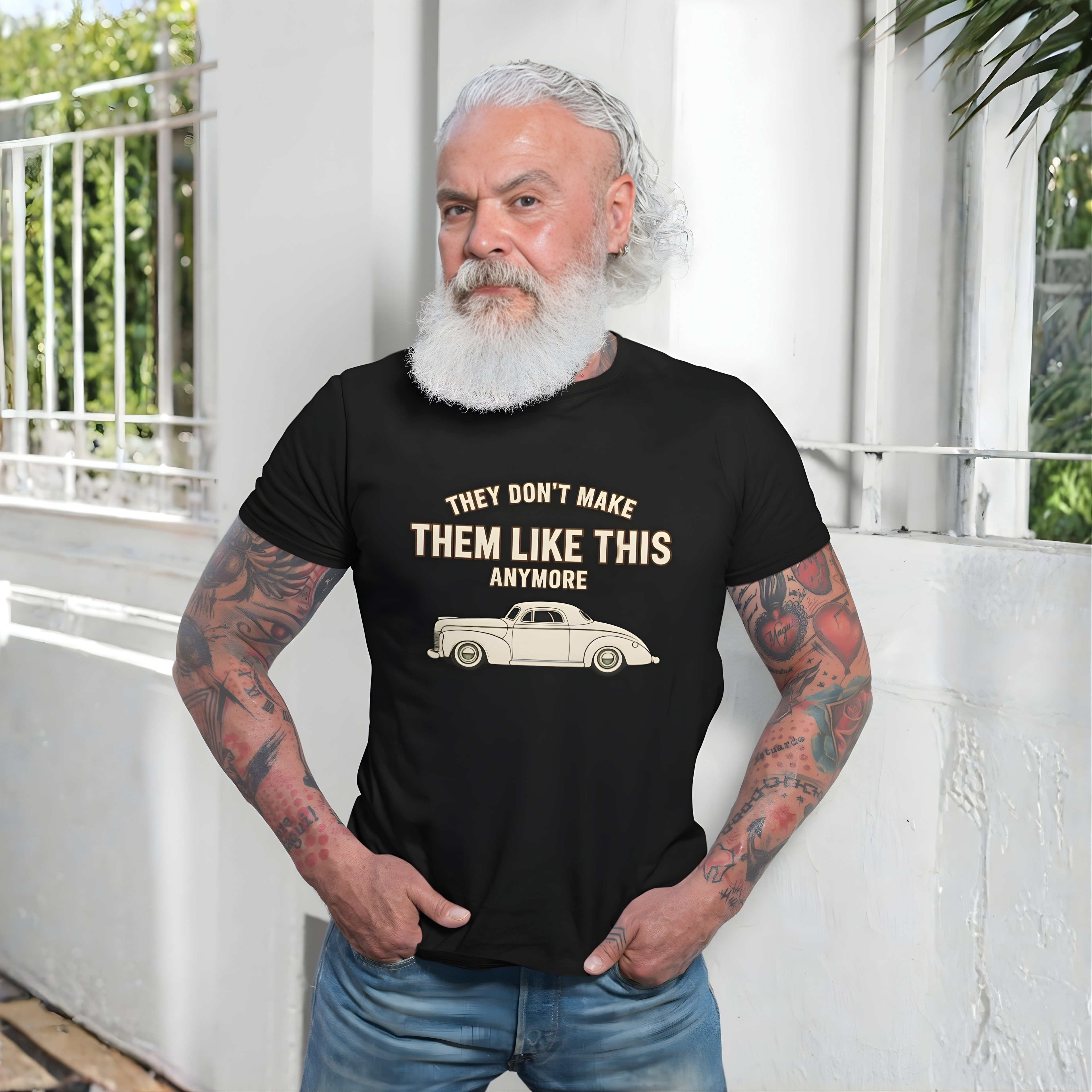 Man wearing a black t-shirt with a graphic and text, standing outdoors.