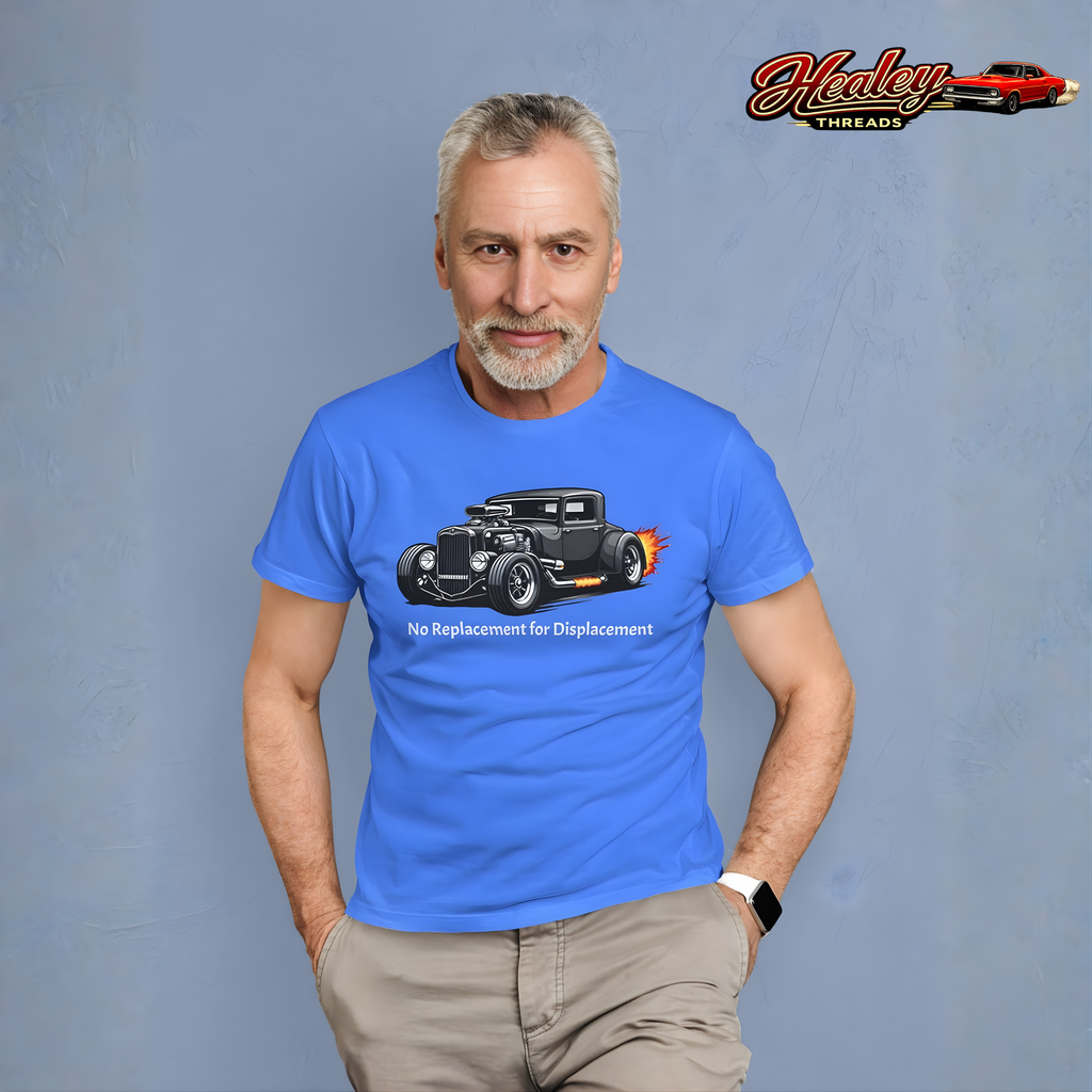 Man wearing a Carolina blue t-shirt with a hot rod graphic and text, standing against a gray background with 'Healey Threads' logo.
