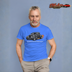 Man wearing a Carolina blue t-shirt with a hot rod graphic and text, standing against a gray background with 'Healey Threads' logo.