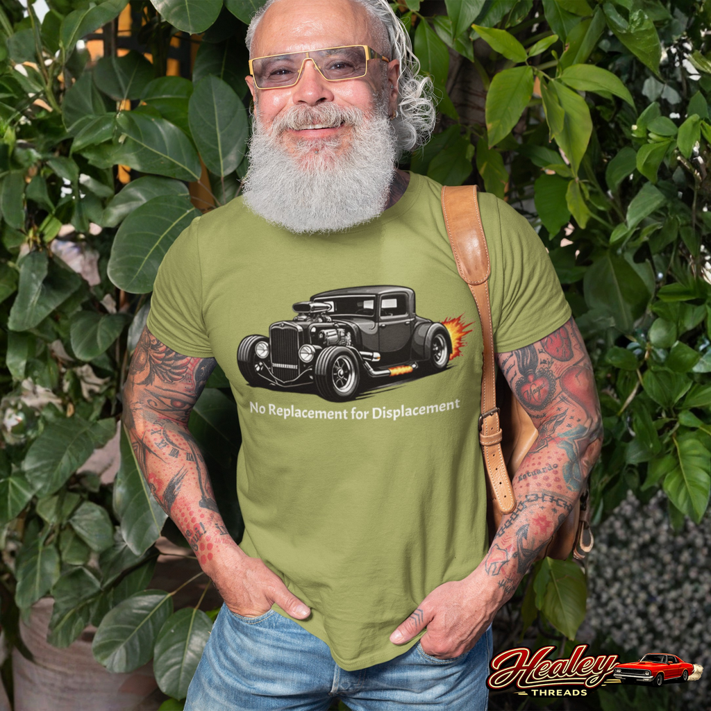 Man wearing a military green t-shirt with a hot rod graphic and 'Healey Threads' branding, standing outdoors.