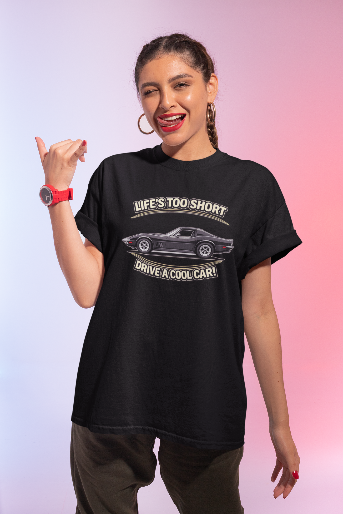 Woman wearing a black t-shirt with a vintage vette graphic and text against a gradient background