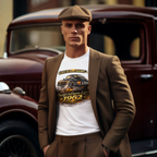 Man wearing a brown suit and flat cap standing in front of an old car, wearing a white t-shirt with a vintage car design.