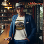 Man wearing a white t-shirt with a classic car graphic design in a bar setting, with 'Healey Threads' logo.