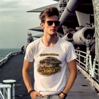 Man wearing a white t-shirt with a classic car graphic design on a ship deck.