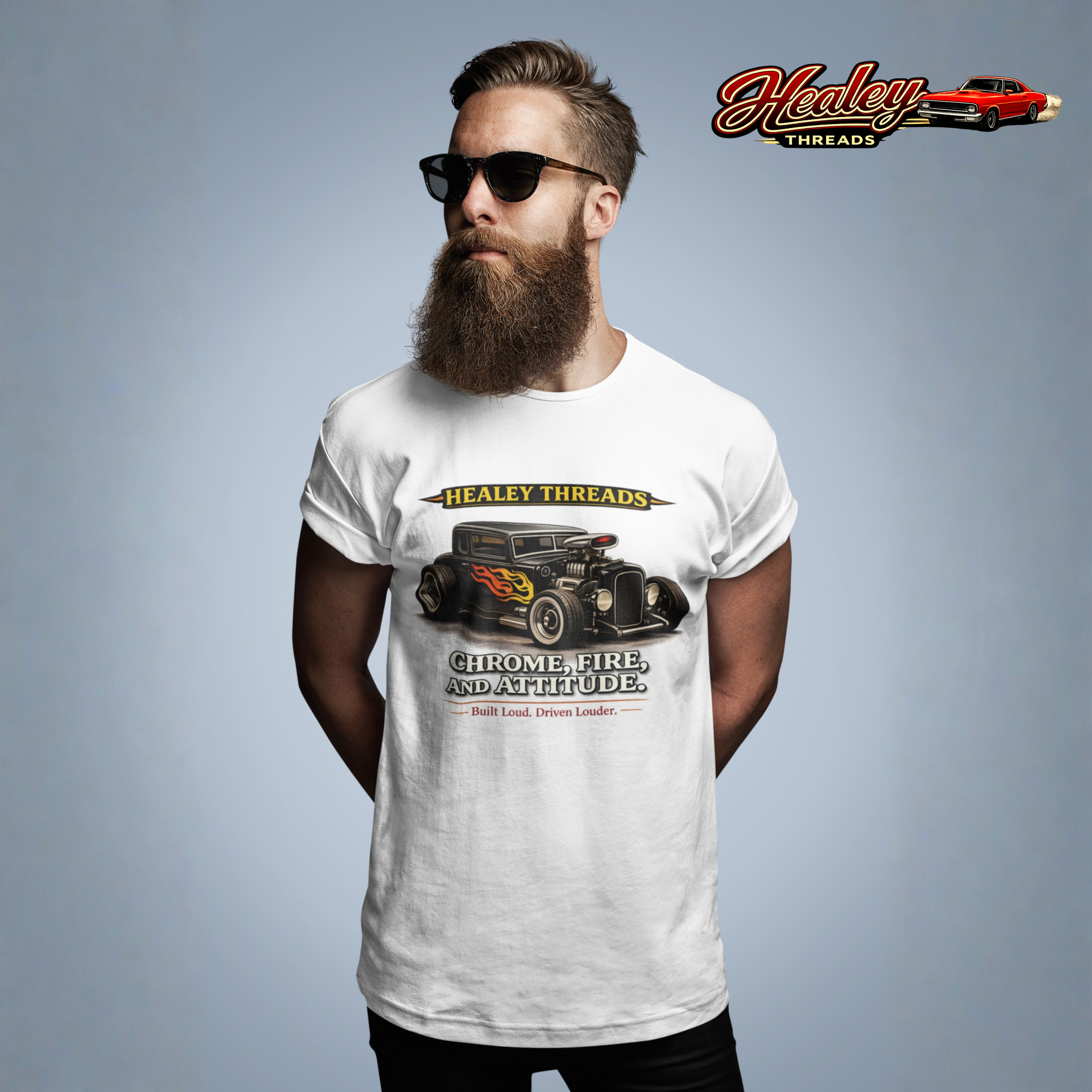 Man wearing a white t-shirt with a hot rod car graphic and 'Healey Threads' branding on a gray background.