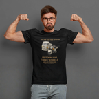 Man wearing a black t-shirt with a graphic tri bike motorcycle with a sidecar design and text, flexing his muscles against a gray background