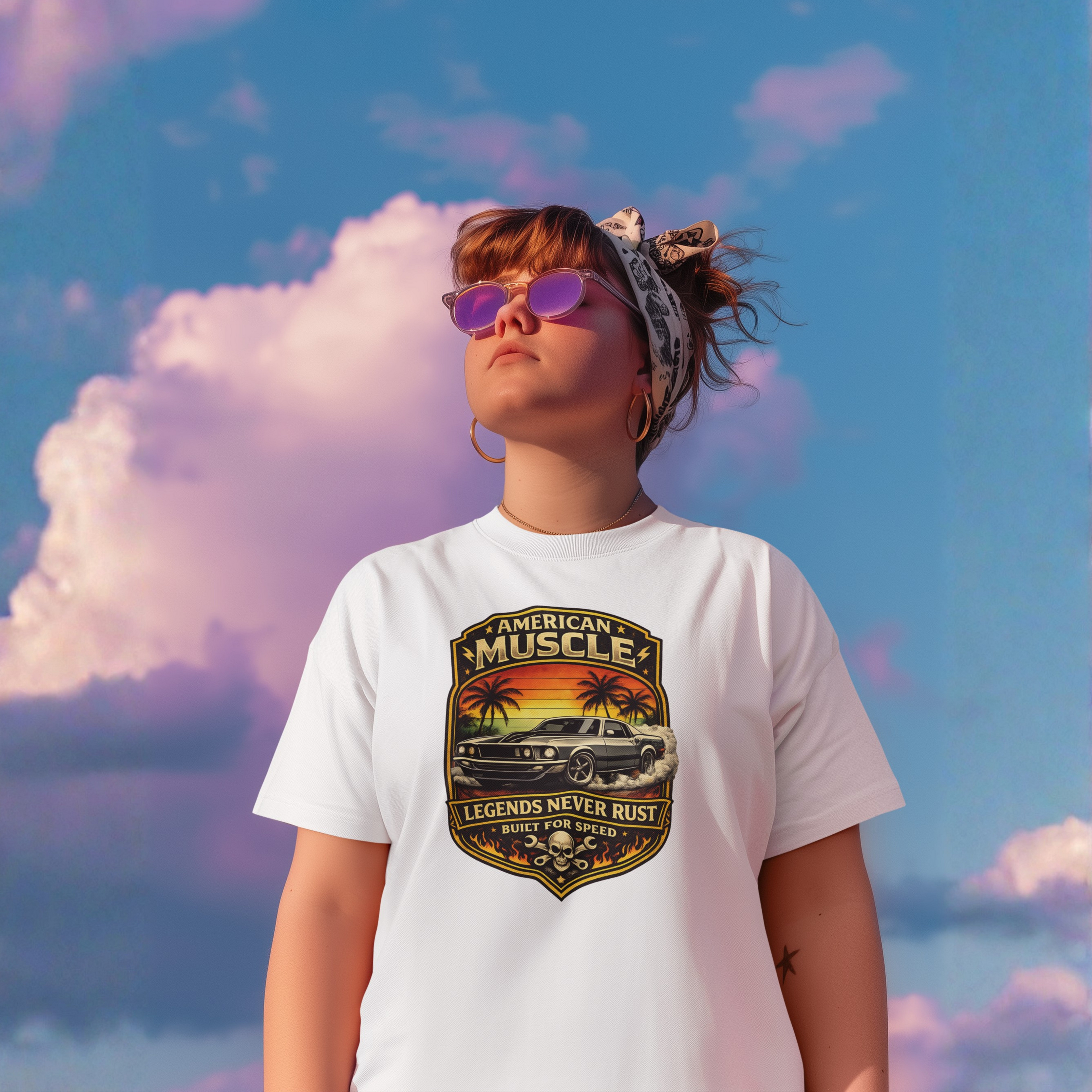 Girl wearing a white t-shirt with 'American Muscle' graphic against a colorful sky.