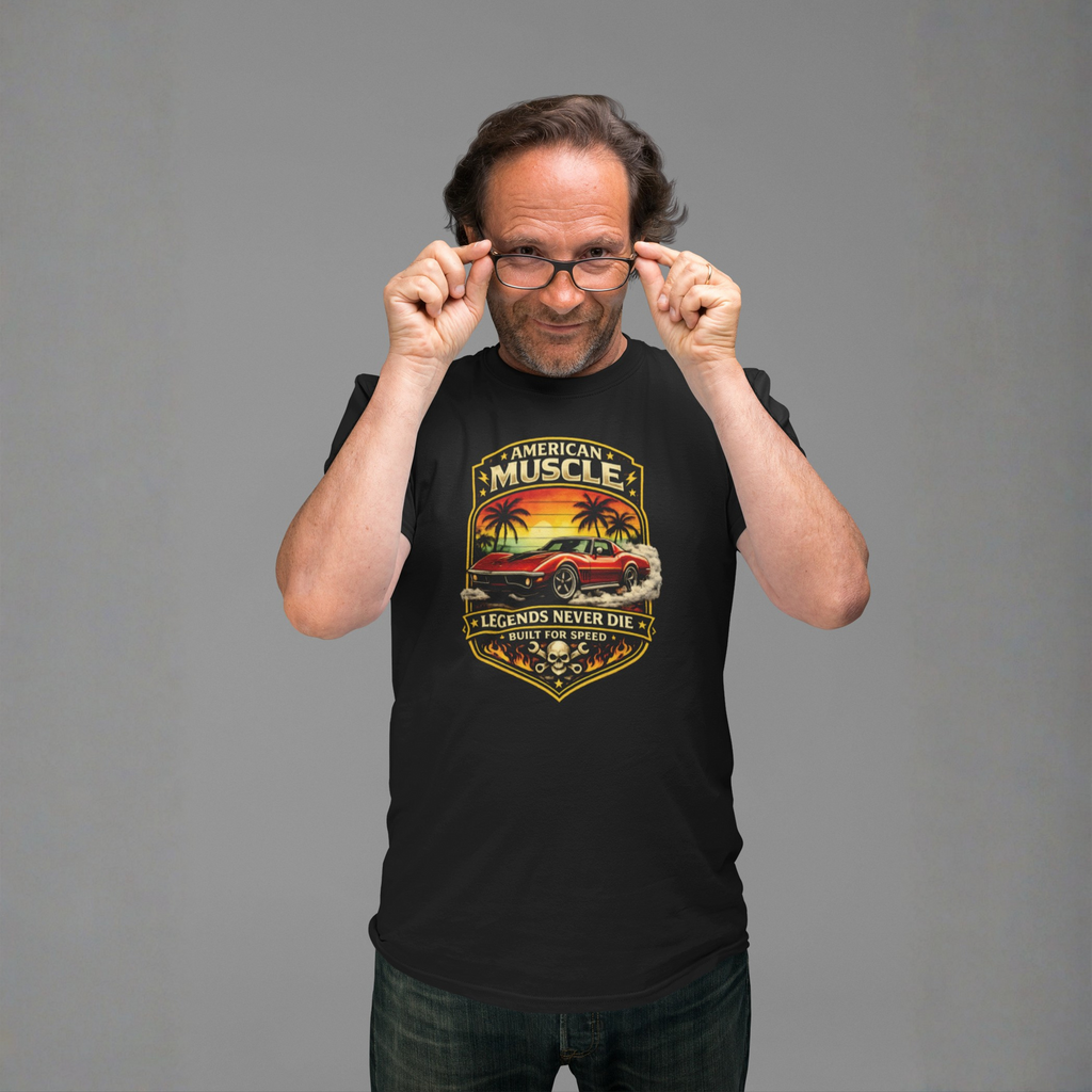 Man wearing a black t-shirt with a classic car graphic design on a gray background 