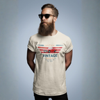 Man wearing a natural t-shirt with a vintage car design on a gray background