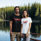 Two people wearing 'Vintage' car t-shirts by a lake with trees in the background